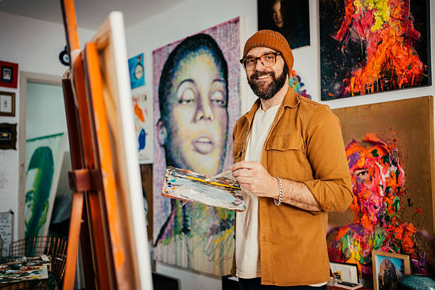 istock Artist painting in his studio 2230675356