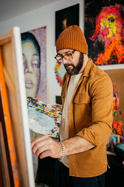 istock Artist painting in his studio 2230675357