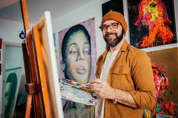 istock Artist painting in his studio 2230675359