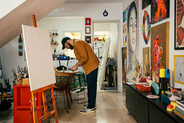 istock Artist painting in his studio 2230675466