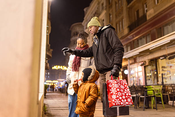 istock Family Shopping on Festive Winter Evening 2230678636