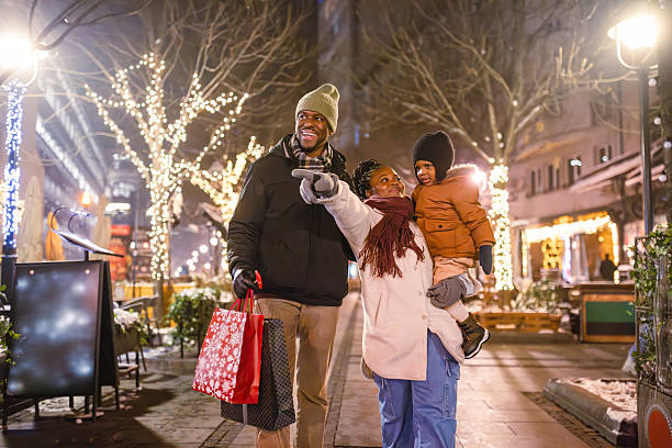 istock Holiday Family Stroll on a Festive Evening 2230678638