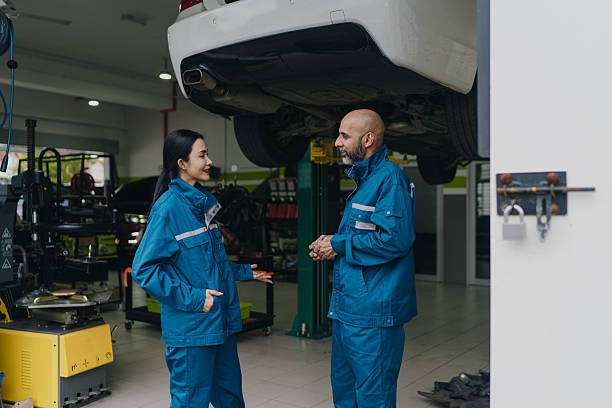 istock Asian auto mechanics co workers taking a break and having a conversation 2230688977