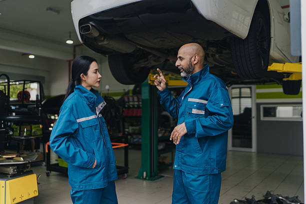 istock Asian auto mechanics co workers taking a break and having a conversation 2230688979