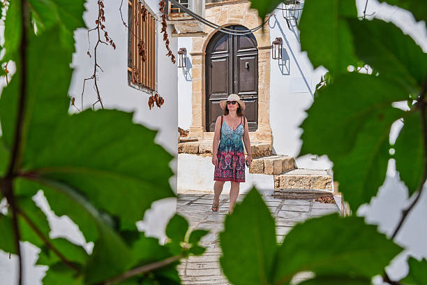 istock Woman explores old village streets, Karpathos 2230690441