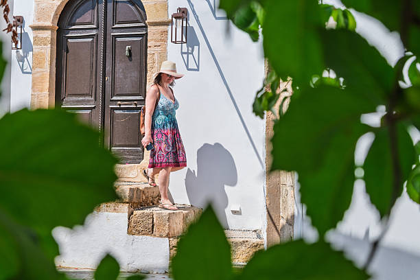 istock Woman explores old village streets, Karpathos 2230690471