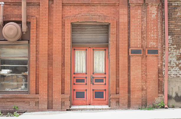 Pink double-doors on a historic bank building in Van Buren, Arkansas