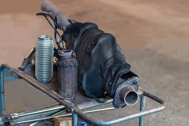 Close-up of a damaged and new Automotive Diesel Particulate  (DPF). Catalytic Converter for the car exhaust system. Details of the product, old and new spare parts of the car exhaust system