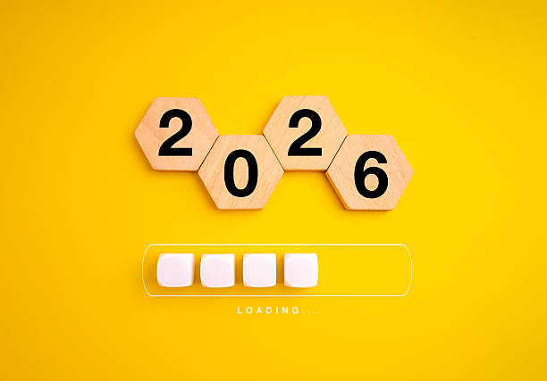 istock Wooden hexagons show 2026 above loading bar on yellow background, symbolizing upcoming year, new beginning, goal planning, future vision, progress, digital transformation and positive mindset concept. 2230694565