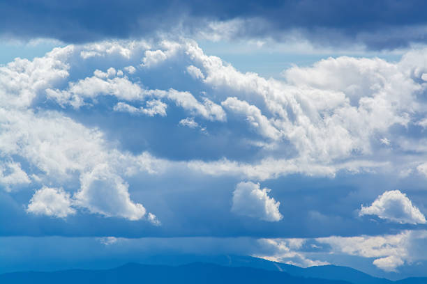 istock View of cloudy weather with three small light clouds 2230697166