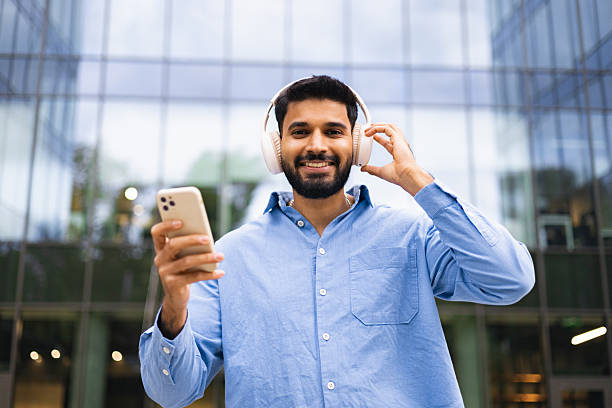 istock Man with Headphones and Phone 2230698740