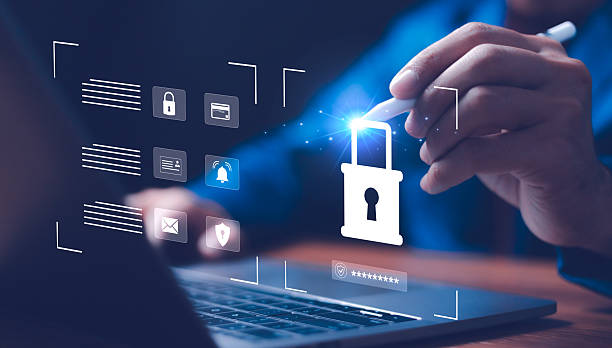 istock Cybersecurity and data protection. A businessman uses a pen to tap a digital screen with a glowing padlock icon, symbolizing secure access, data privacy, and online security in a business environment. 2230700848