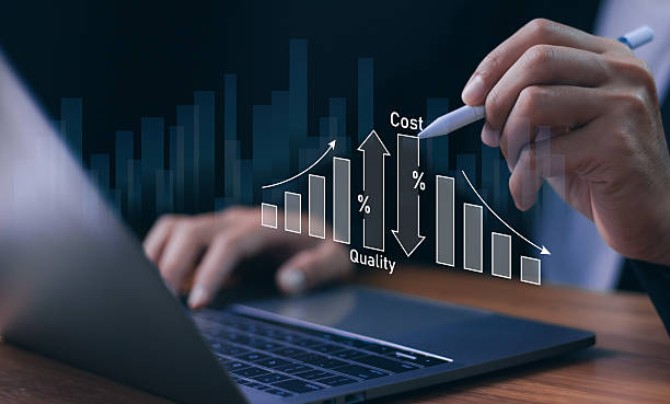 istock Cost reduction and quality improvement strategy. A businessman analyze a digital graph showing arrows Cost and Quality, business efficiency, process optimization, and strategic management. 2230700887