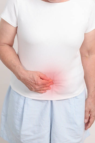 Elderly woman having Colon pain for Colonic disease, Inflammatory Bowel, IBD, Colorectal cancer, Ulcerative colitis, Diverticulitis, Irritable bowel syndrome, Digestive system and Health concept