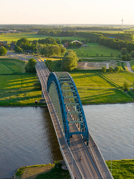 istock Bridge in a springtime colorful sunset over the river IJssel 2230708029