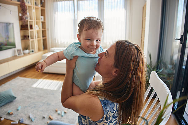 istock Cheerful baby boy playing with mother 2230708944