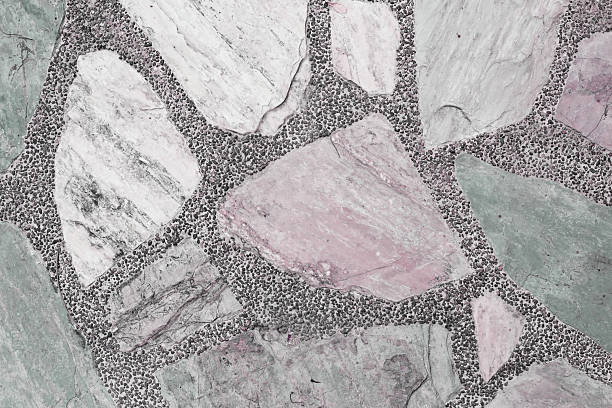 Decorative stone pavement with irregularly shaped natural rocks set in concrete.