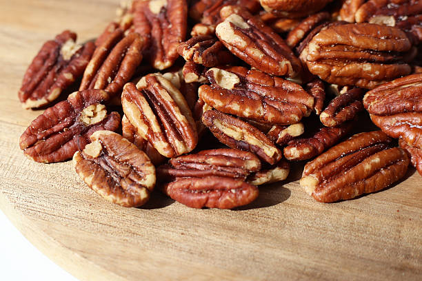 istock Delicious salted pecan nuts scattered. 2230712106