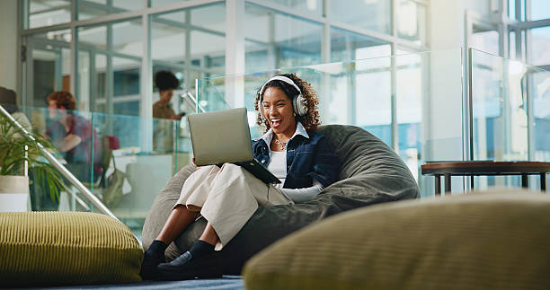 istock Laptop, smile and video call with student in college for streaming, online class and study webinar. University, digital course and elearning with woman and headphones for virtual lesson and exam 2230712192