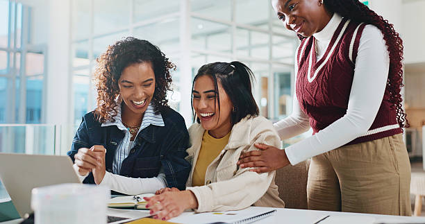 istock Group, university and students with laptop, excited and achievement with email for test results. People, women and friends with pc, education goals or scholarship with feedback for bursary or support 2230712236