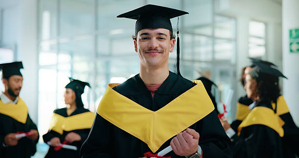 istock Portrait, students and graduation with man, university and scholarship with celebration. Pride, person or group with degree, ceremony or higher education with milestone, excited or goals with diploma 2230712642