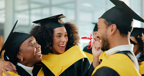 istock Happy people, students or graduation in celebration for qualification, degree or diploma together. Excited group, friends or graduate with smile, certificate or milestone for education or scholarship 2230712688