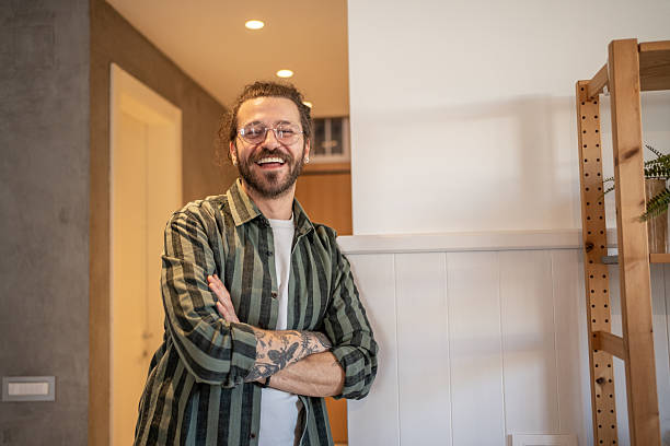 istock Young freelancer smiling with crossed arms in home office 2230724230