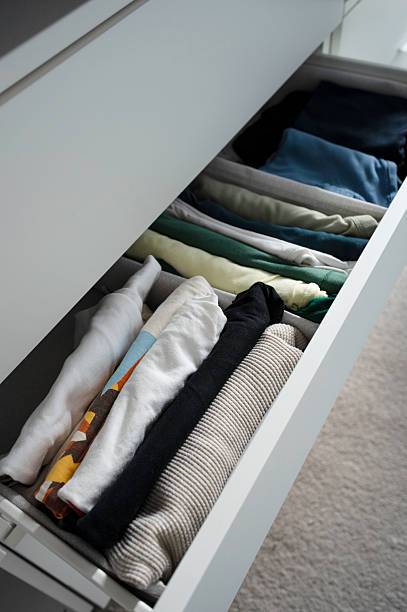 istock Neatly Folded Clothes in Organized Drawer 2230726441