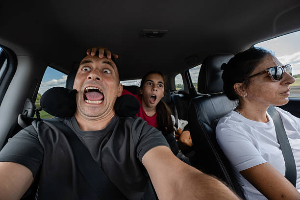 istock Scared family screaming while driving in car during road trip 2230726527