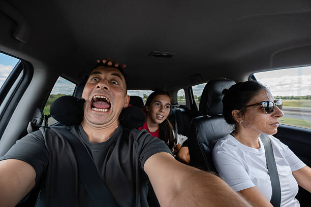 istock Family taking risky selfie while driving on highway 2230726529