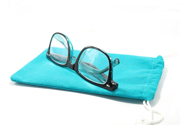 Reading spectacles with black plastic frames and clear lenses isolated on a white background