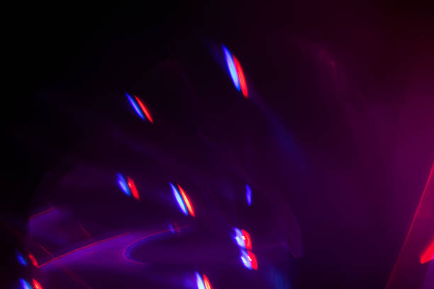 istock Blurred Light painting one exposure in camera. light glares with a spectral gradient on a dark background. 2230737880