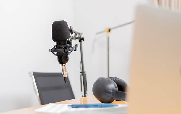 istock Modern office studio equipment microphone setting, laptop, tablet and headphone 2230738568