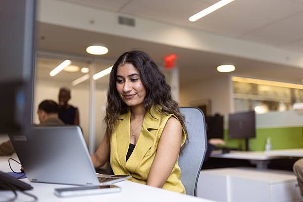 istock Focused Professional Woman Working in Modern Office 2230738599
