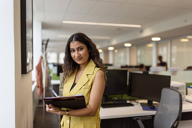 istock Confident Businesswoman in Modern Office Setting 2230738659