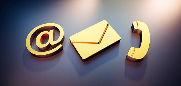 Golden communication symbols in bright light on dark background - 3D illustration with copy space