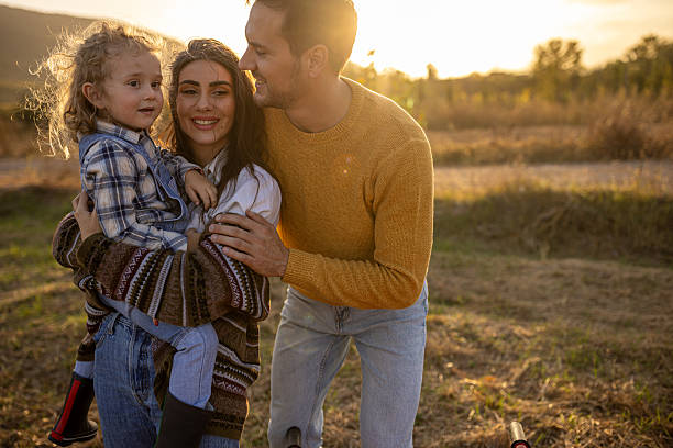 istock Family happiness at autumn sunset 2230742264