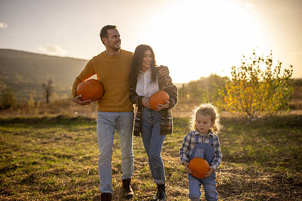 istock Family in a pumpkin patch 2230743898