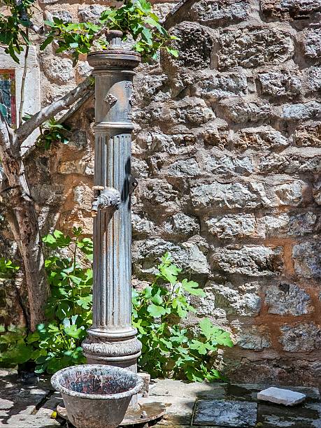 istock Old stone water column, wide shot, Budva 2230745718