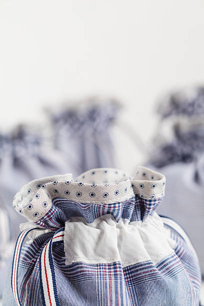 istock Blue linen drawstrings bags on a white background. Eco friendly handmade drawstring bags. 2230754188