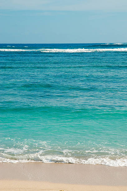 istock Waves Washing Ashore on Sandy Tropical Beach in Malang, Indonesia 2230756638