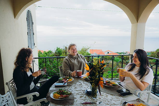 istock Happy Three Multigenerational Women Enjoying Breakfast at Patio With Ocean View 2230757835