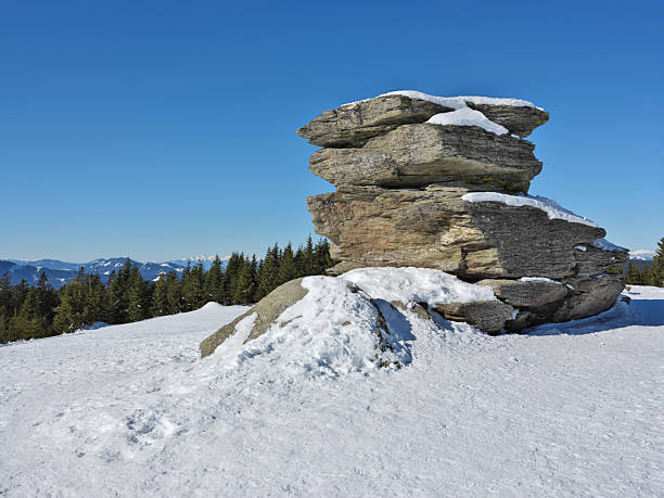 The so called Devil`s Stone is a legendary cult site on the mountain summit Teufelstein and consists of three individual rock blocks formed by different erosion of the different rock types. The legend says that the fallen angel Lucifer wanted to build a tower here that would reach up into the sky so that he could return to heaven. Photos were taken during a winter snowshoeing tour.
