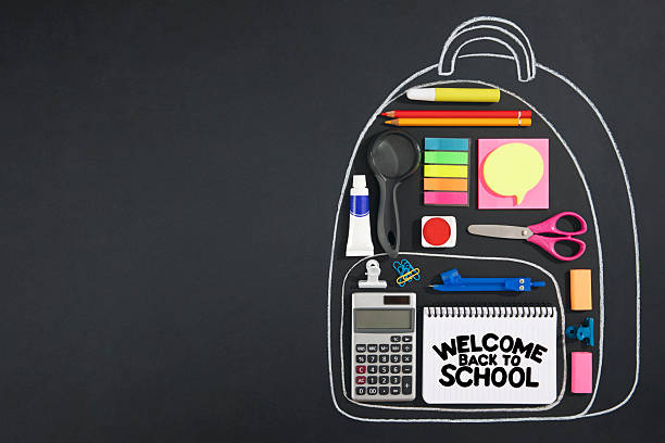 Back to school concept with chalk drawing backpack with school supplies on chalkboard