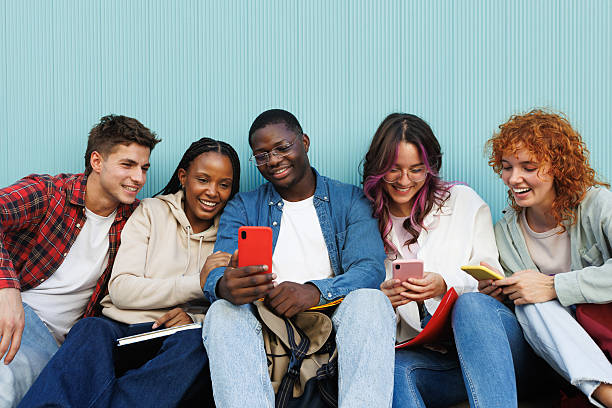 istock University students using smartphones and having fun together 2230761833