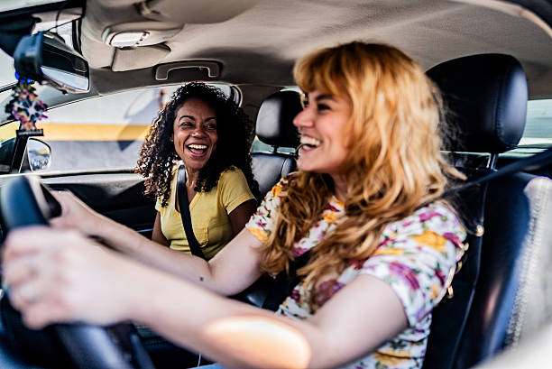 istock Friends women talking inside car 2230770806
