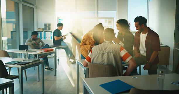istock Education, lecture and friends or students in classroom for discussion, college or exam feedback. University lesson, scholarship opportunity or support with people on campus for test report and flare 2230771390