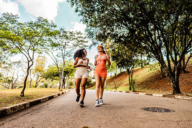 istock Friends women running on public park 2230772764