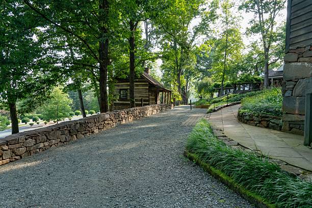 Charlottesville Virginia, United States – July 31, 2025: Late morning view of Meadows Run with historic 18th-century log cabins