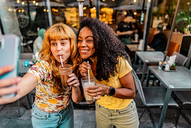 istock Friends taking a selfie at sidewalk cafe 2230773358